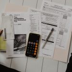 Family reviewing college financial aid documents at a desk