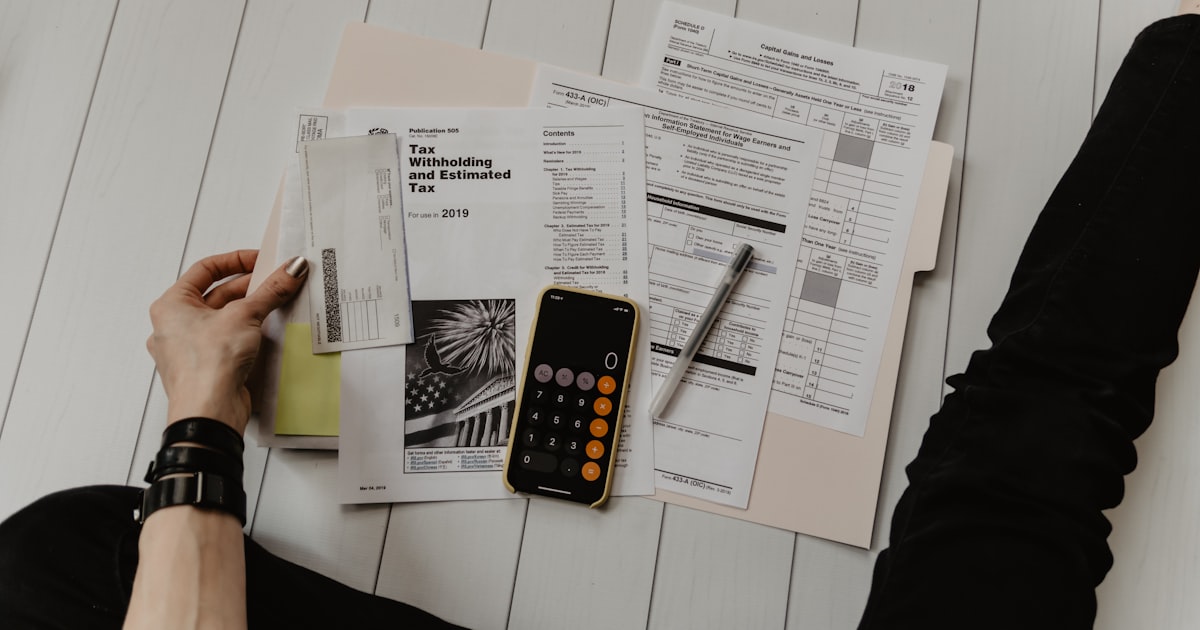 Family reviewing college financial aid documents at a desk