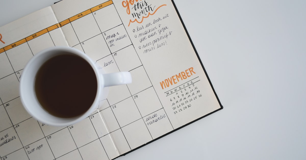 Planner calendar and laptop for Class of 2030 first-semester college course registration planning