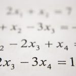 Handwritten math equations representing ACT Math summer prep