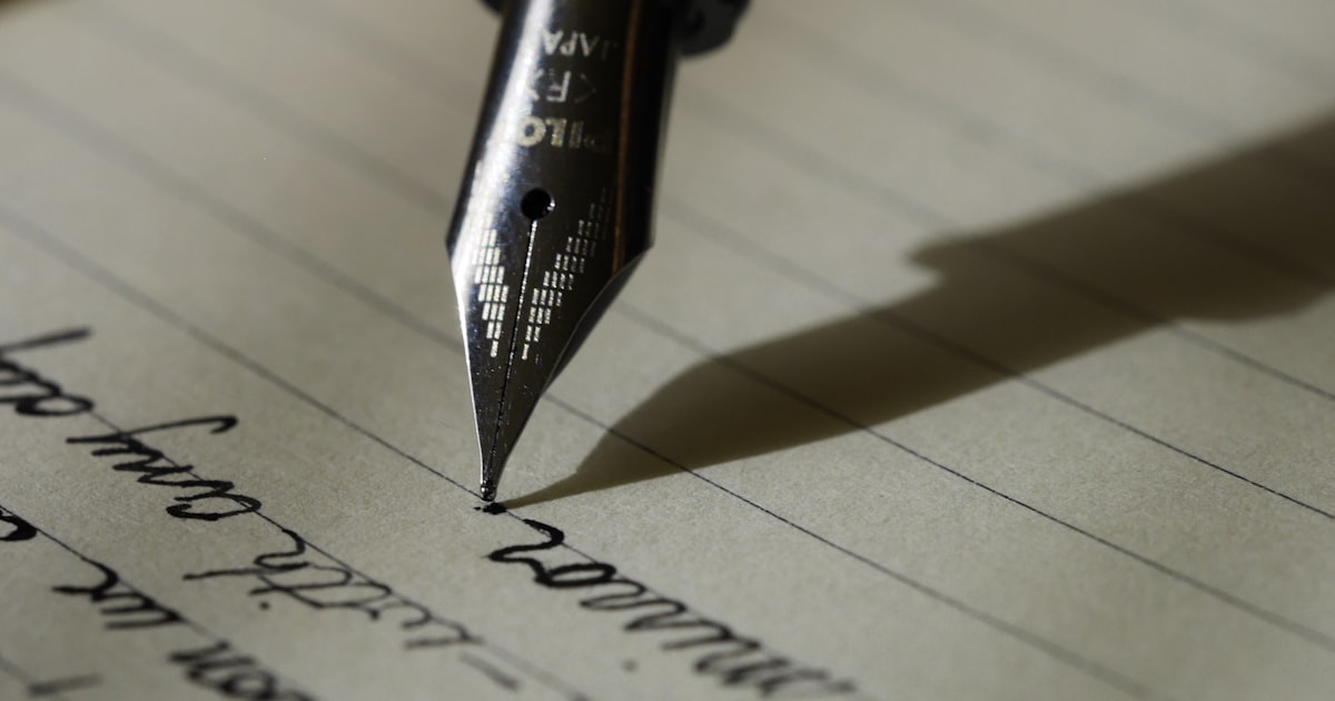 Student editing an essay by hand, practicing ACT English grammar and rhetorical skills