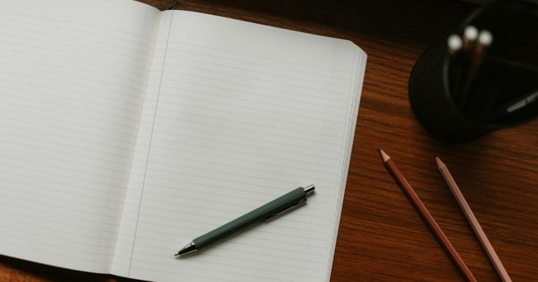 An open notebook with a pen, set up for reviewing English grammar and punctuation rules
